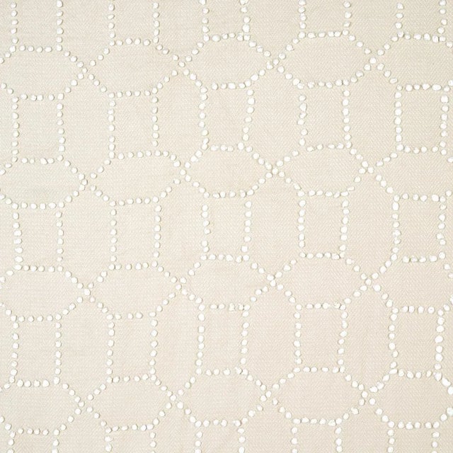 Hand-embroidered chenille French knots form a delicate and perfectly imperfect geometric pattern on a silky cotton-linen...