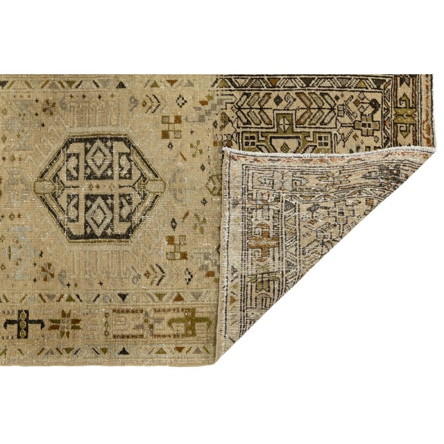 Elevate your space with this exceptional antique Heriz (Serapi style) wool runner, a masterpiece of understated luxury....