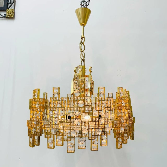 Italian Mid-Century Modern Chandelier / Pendant, Brass City by Gaetano Sciolari High quality eccentric mid-century modern...