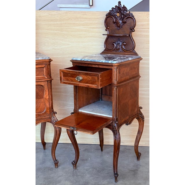 Two very nice elegant France nightstands. Grey marble tops on cabriole legs. The interior compartment was made of white...