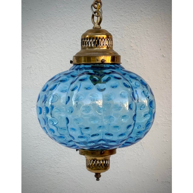 Beautiful blue optic glass pendant in the style of murano / mid- century Italian. Lovely brass work and canopy. Glass in...