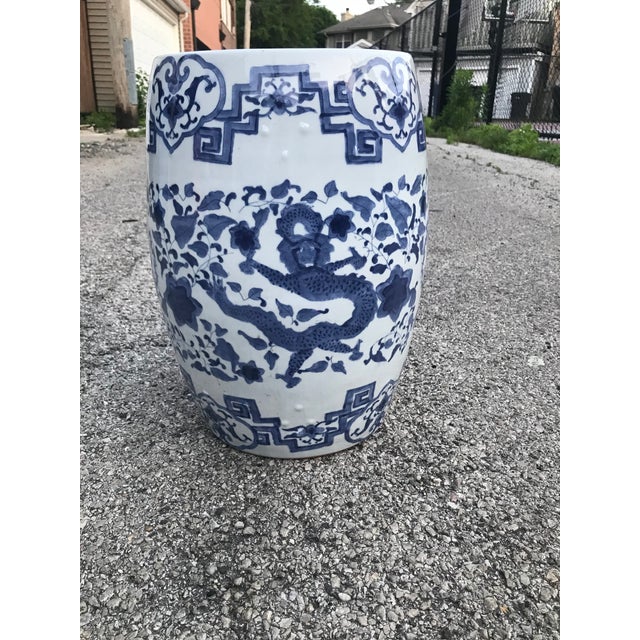Beautiful chinoiserie blue & white ceramic garden stool/accent table. Features dragon and bird motifs; hand painted....