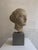 Carrara marble sculpture depicting the head of a young woman from the second half of the 19th century. This Hellenistic-...