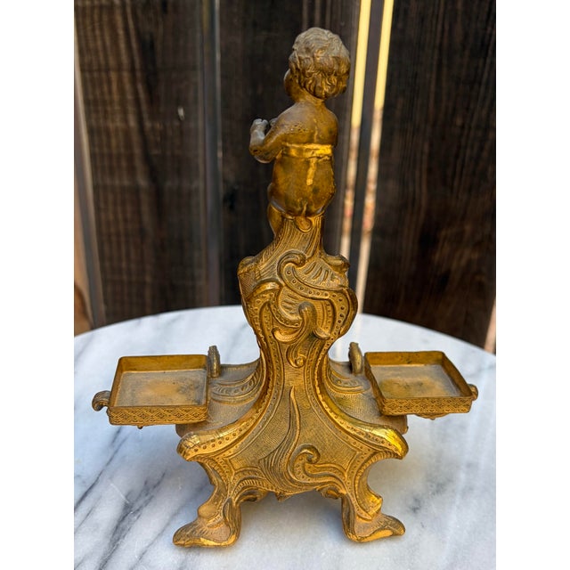 DESCRIPTION: An exceptional late 19th or early 20th-century antique French Rococo carpenter-style gilt brass double...