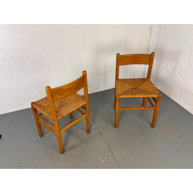 Set of 2 dining chairs designed by Johan van Heuvel in 1957 for his own studio Ad Vorm. These chairs are quite hard to...