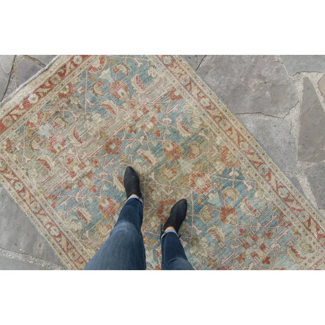 A beautiful hand-knotted rug that spotlights an all-over design using a botanical motif. With naturally distressed areas,...