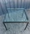 Square coffee table with a matte black lacquered metal frame and a 1.5 cm thick glass top. Please note, as shown in the...