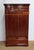 Solid and plated mahogany cabinet, opening with 2 doors with molded frames and panels with pretty veinings, open books....
