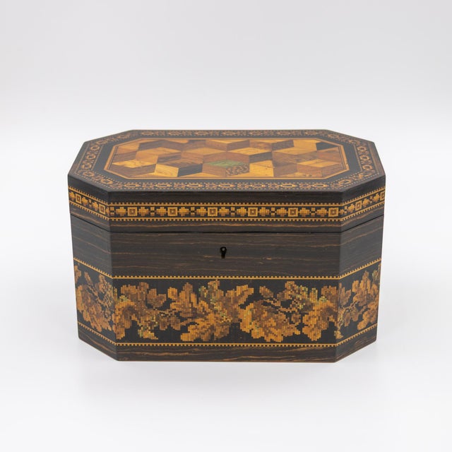 A hexagonal Tunbridgeware tea caddy attributed to Thomas Barton 1, the lid inlaid with a central tumbling block mosaic...