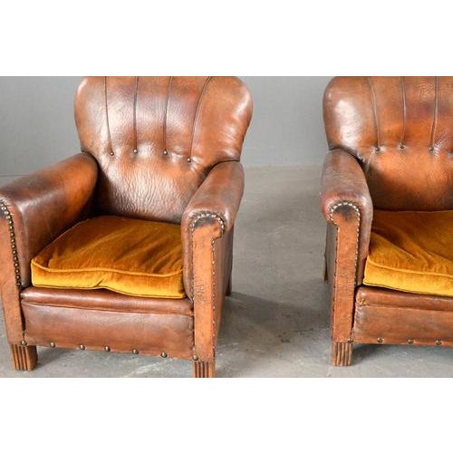 Pair of French Art Deco Leather Armchairs Circa 1920s Scalloped back - Mustard coloured cushions - Oak feet - Brass...
