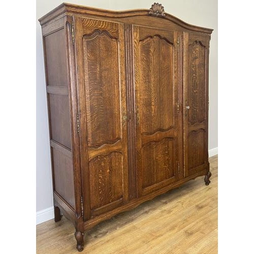 This elegant Vintage French Louis wardrobe showcases timeless craftsmanship with beautifully grained wood, classic...