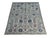Ivory field with an allover Sultanabad lattice: angular vines in slate blue and moss link jagged palmettes, rosettes,...