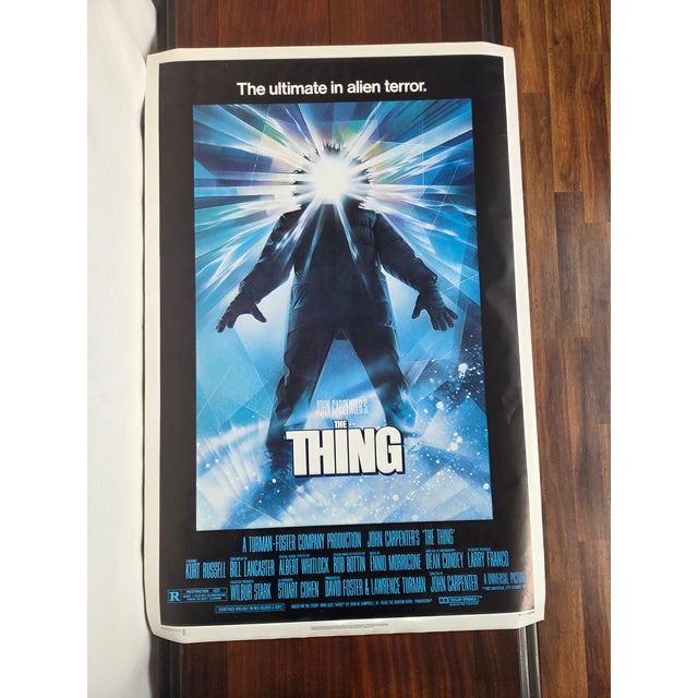 This original 1982 theatrical one-sheet for The Thing stands as one of the most iconic images in horror and science...