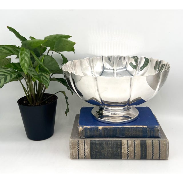 Striking fluted pedestal bowl by Fisher Silversmiths in the classic “Dublin” pattern, featuring a softly scalloped rim and...