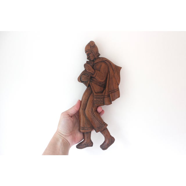 Width: 5 inches Height: 11 1/2 inches Depth: 3/4 inches About this item This is a hand carved man or boy pied piper or...