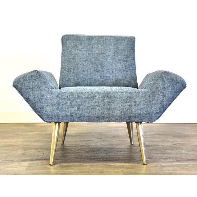 A mid century modern newly reupholstered lounge chair designed by Adrian Pearsall for Craft Associates with tapered brass...