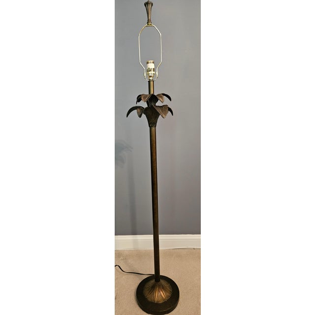 This floor lamp has beautiful detail and would fit in with many decorating styles. With its palm design it would look...