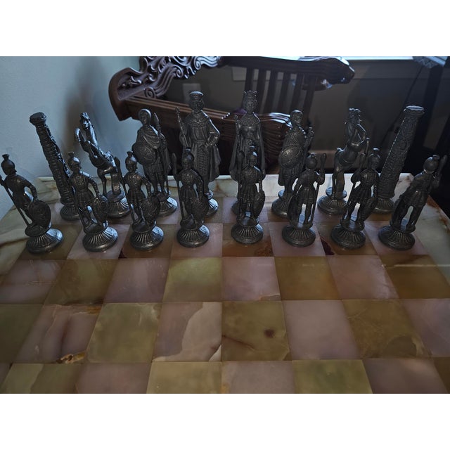 Savonarola-style chess table set, featuring two folding chairs with lion head armrests and a table with a removable marble...