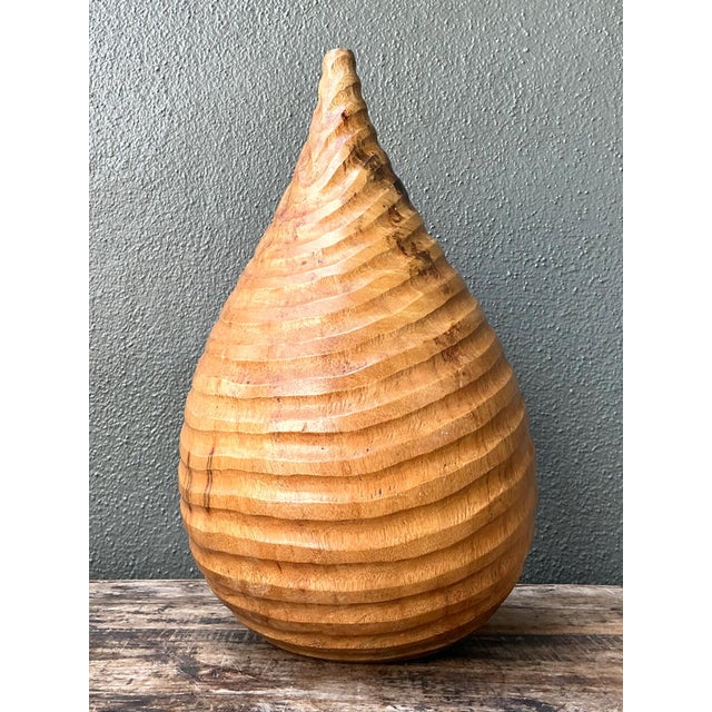 This vintage natural wood teardrop vase is a refined example of mid-century modern design, celebrating organic form and...