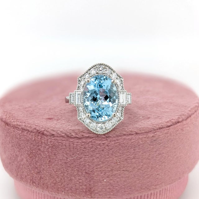 This beautiful ring features a 4.39 carat Aquamarine gemstone with natural earth mined diamonds and milgrain detail, set...
