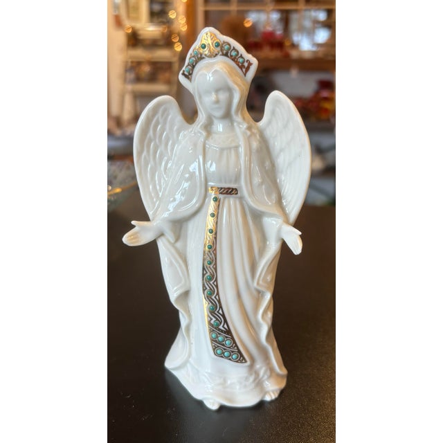 This is a beautiful Lenox Jewels Collection angel with open arms at her sides. The statue is adorned with gold and green...