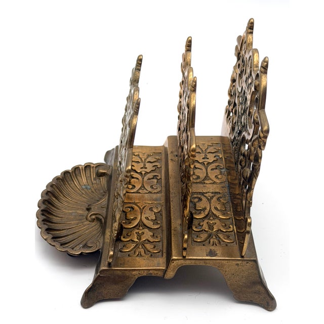 Add a touch of timeless European elegance to your workspace with this exceptional antique heavy-cast brass letter rack....