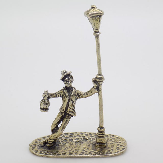 Curious vintage miniature depicting a drunk man leaning against a streetlamp, handcrafted in Italy between the 1980s and...