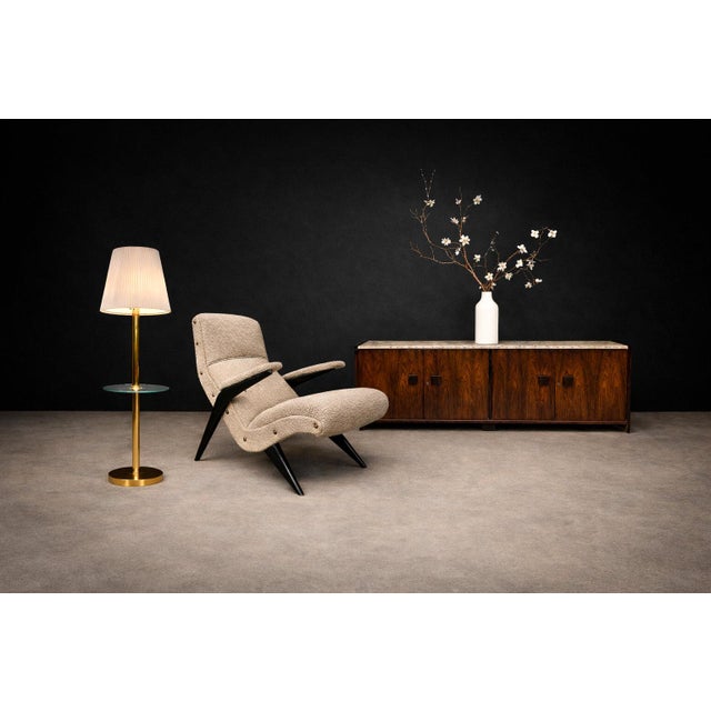 A sculptural Brazilian Modernist lounge chair from the 1950s defined by its bold, architectural stance and exceptional...