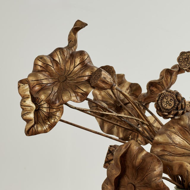 Standout vintage bouquet composed with Chinese hand carved gilt wood lotus leaves set in a Korean celadon porcelain vase...