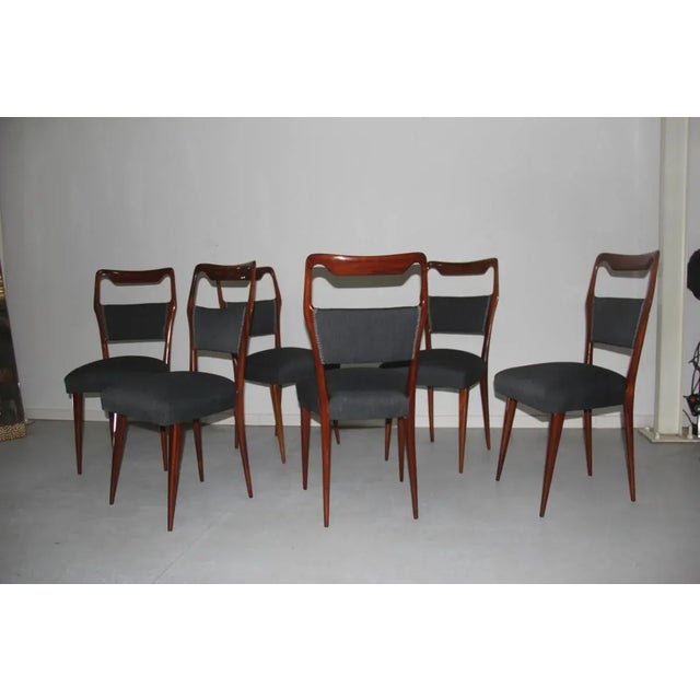 This set of mid-century Italian chairs was produced in the 1950s.