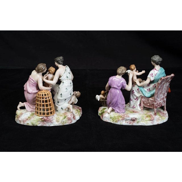 Pair of polychrome Meissen porcelain sculptures depicting scenes of motherhood, dating from the late 19th century....