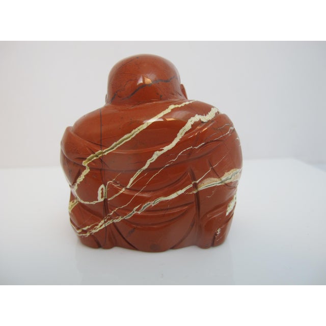 Kalifano Red Jasper hand carved Buddha figurine, featuring a striking deep red stone with natural white and brown mineral...