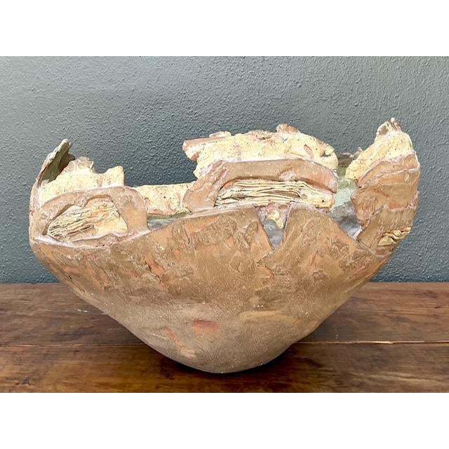 This monumental studio pottery bowl is a masterclass in Brutalist ceramic art, offering a raw and commanding presence....
