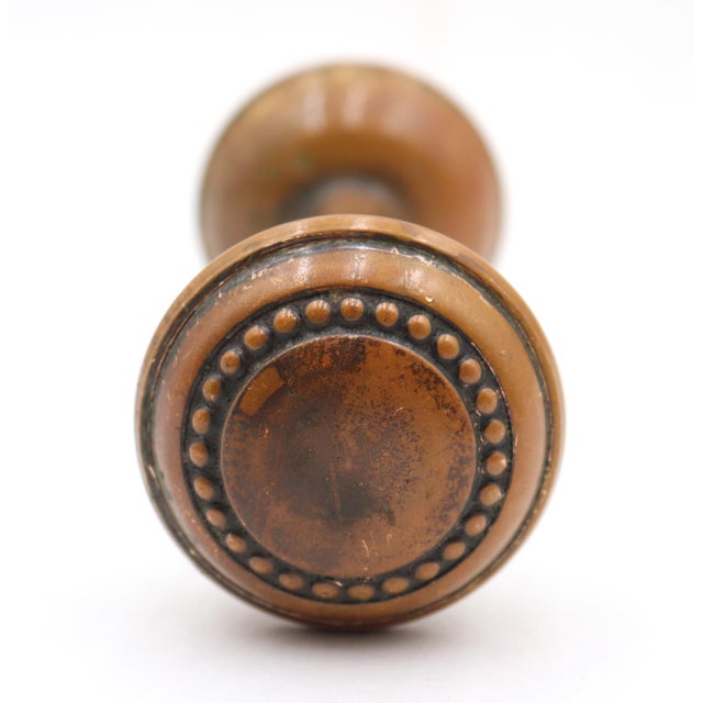 Vintage beaded passage door knobs made of brass with a patina finish. Priced as a pair of knobs with a spindle. Good...
