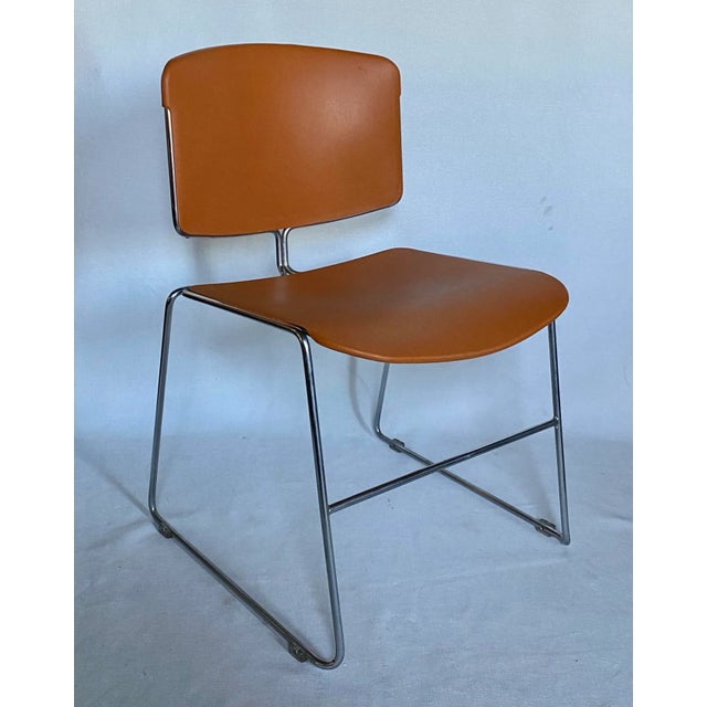 Mid-Century Modern Max Max-Stacker office conference room chairs by Steelcase in iconic orange. These comfortable lounge...