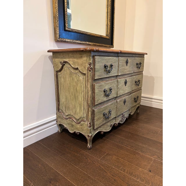 A beautifully crafted three-drawer chest by Minton-Spidell, designed in the elegant Louis XV style and reflecting the...
