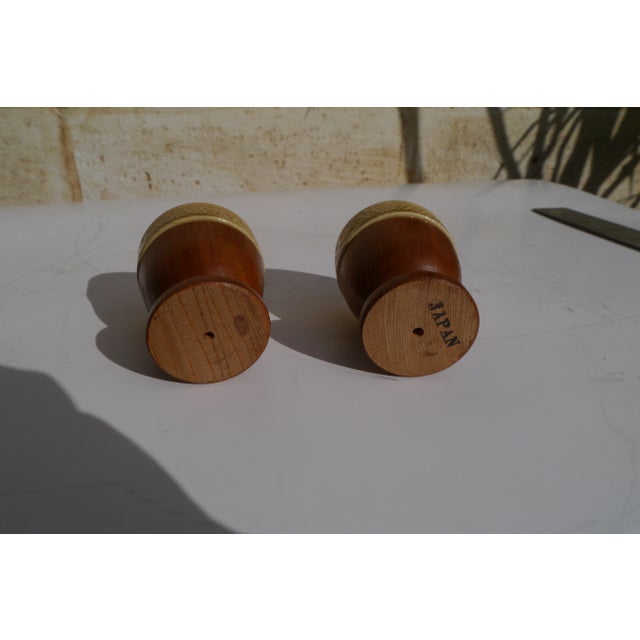 2 Vintage Wood and Ceramic Retro Egg Cups. Gold & Brown. A sweet set of 2 mid century egg cups. Made of wood with ceramic...