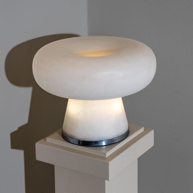 Large 1960s table lamp attributed to Fontana Arte, featuring a conical base, chrome fittings, and a large circular opaline...