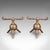 This is a pair of antique fireside tool rests. An English, brass fire dog in Aesthetic Movement taste by Dr Christopher...