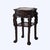 A Chinese antique side table, crafted from richly toned rosewood around 1920. The piece features an octagonal top inlaid...