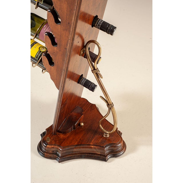 A distinctive floor-standing wine rack designed to hold five bottles horizontally for proper storage and easy display. The...