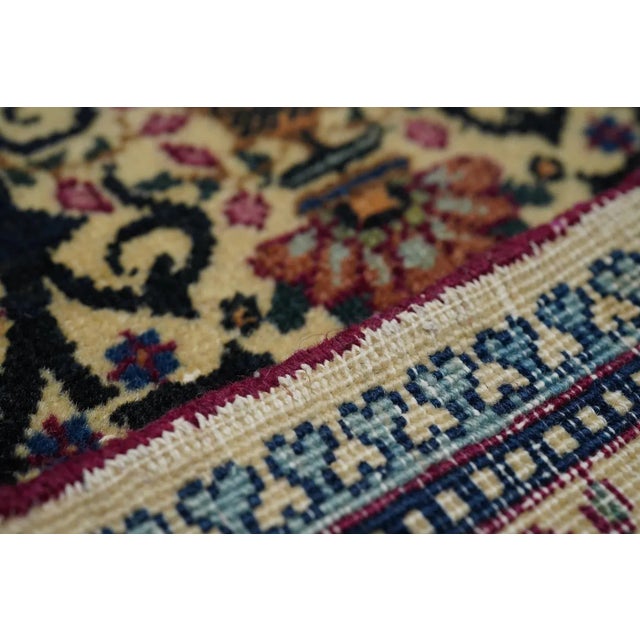 All eggshell, field and borders, with small, dense, allover textile patterns of, in the field, a skeletal escutcheon and...