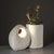A beautiful decorative lamp, half of which serves as a vase, made of hand-carved Pierre du Gard stone, unsigned but...