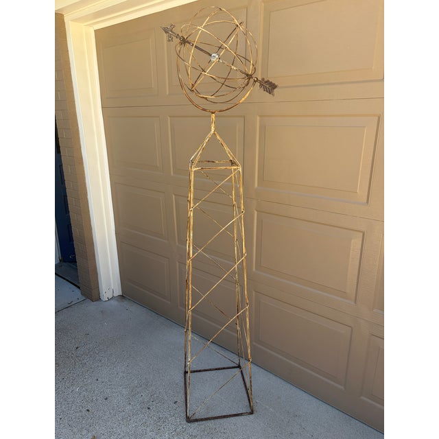 A beautifully crafted iron armillary sphere on stand, evoking the timeless elegance of classical European gardens. Pieces...