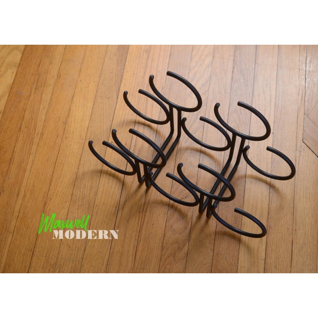 One of the coolest wine racks ever! I have never seen this design before. This postmodern era wine rack is made of black...