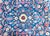 A beautiful early 20th century Persian Kashan rug with a a central yellow flower medallion living in a field of more...