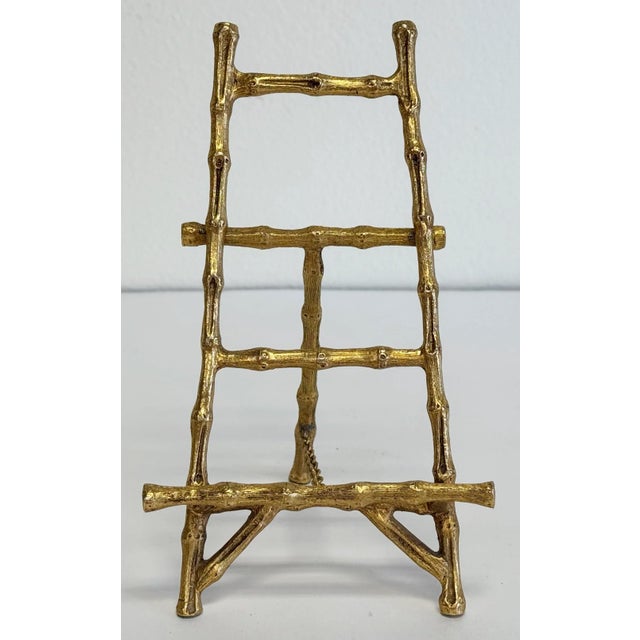 Vintage brass decorative faux bamboo tabletop easel featuring bamboo pattern throughout. Extends to 3.5"L. Natural age...