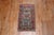 A vintage Anatolian Turkish rug mat with a brown field, cotton accents in electric blue, pink, teal, green, turquoise and...