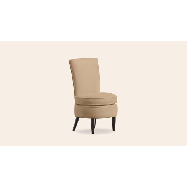 This beautiful occasional chair is offered in many different fabrics within our collections. It has a softly rounded back...