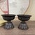This elegant pair of bronze candlesticks features a classic lotus design, a traditional symbol of purity and...